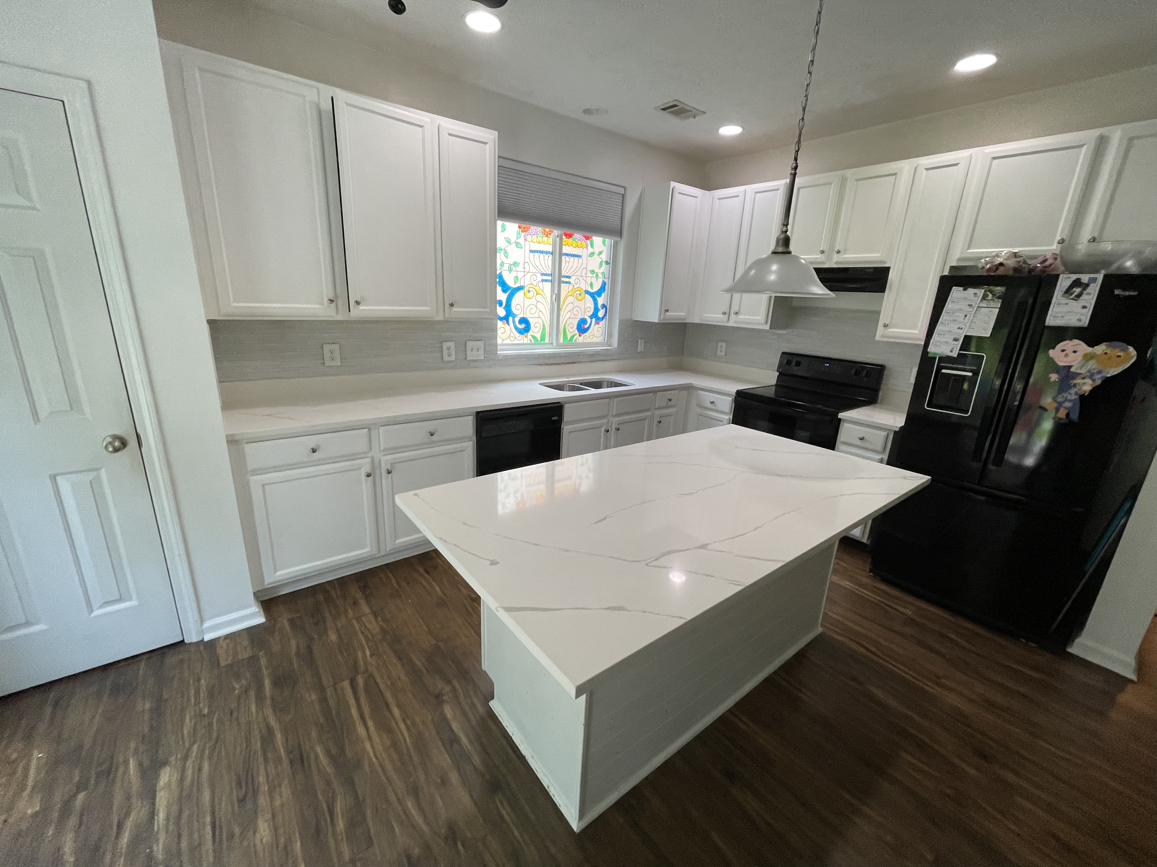 White quartz island and perimeter countertops